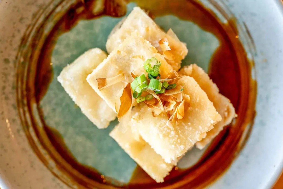 Fried tofu topped with scallions and bonito flakes at Wabi Wok & Ramen, an Asian Restaurant in Milford