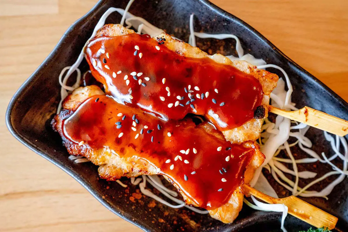 Teriyaki chicken skewers with sesame seeds at Wabi Wok & Ramen, an Asian Restaurant in Milford