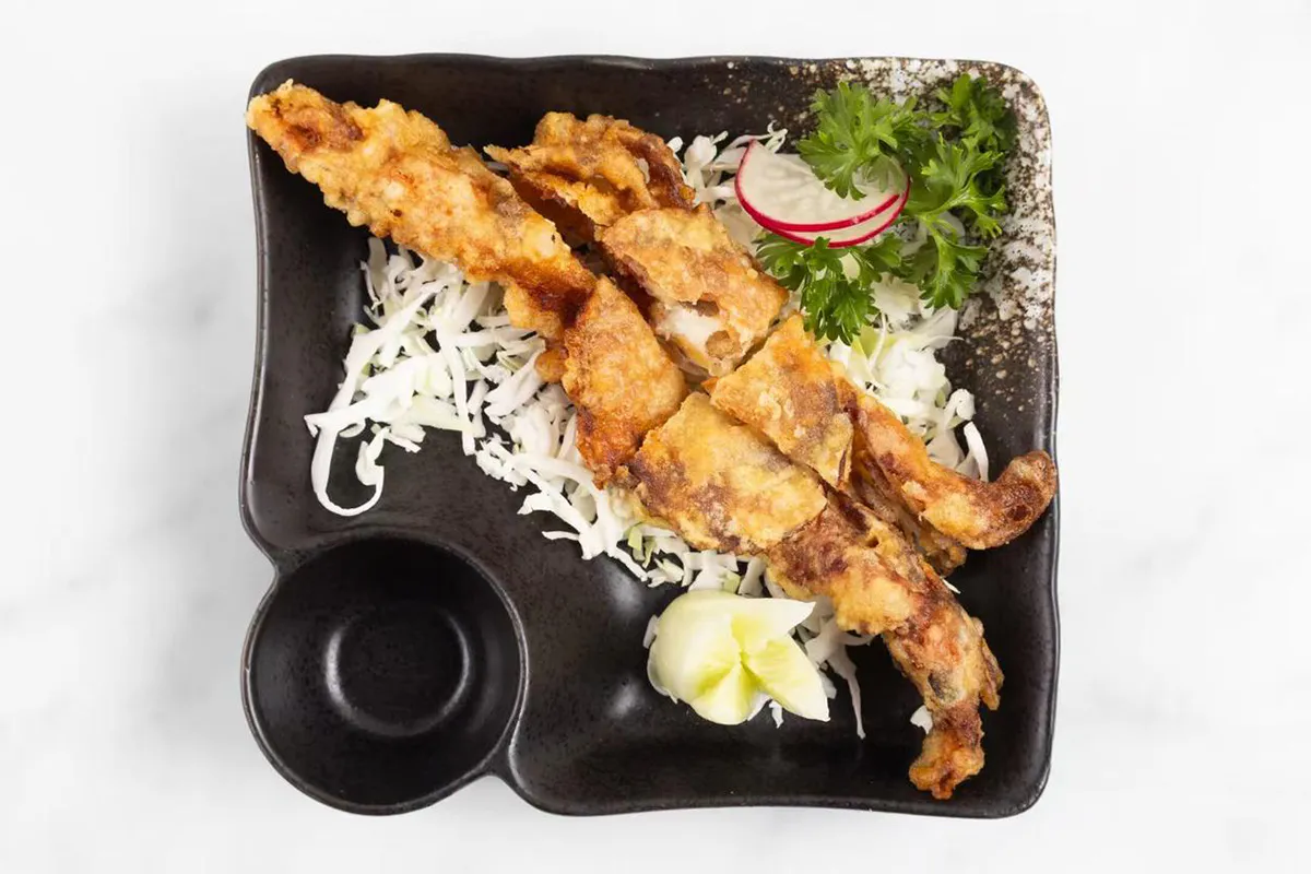 Fried soft shell crab with cabbage and garnish at Wabi Wok & Ramen, an Asian Restaurant in Milford