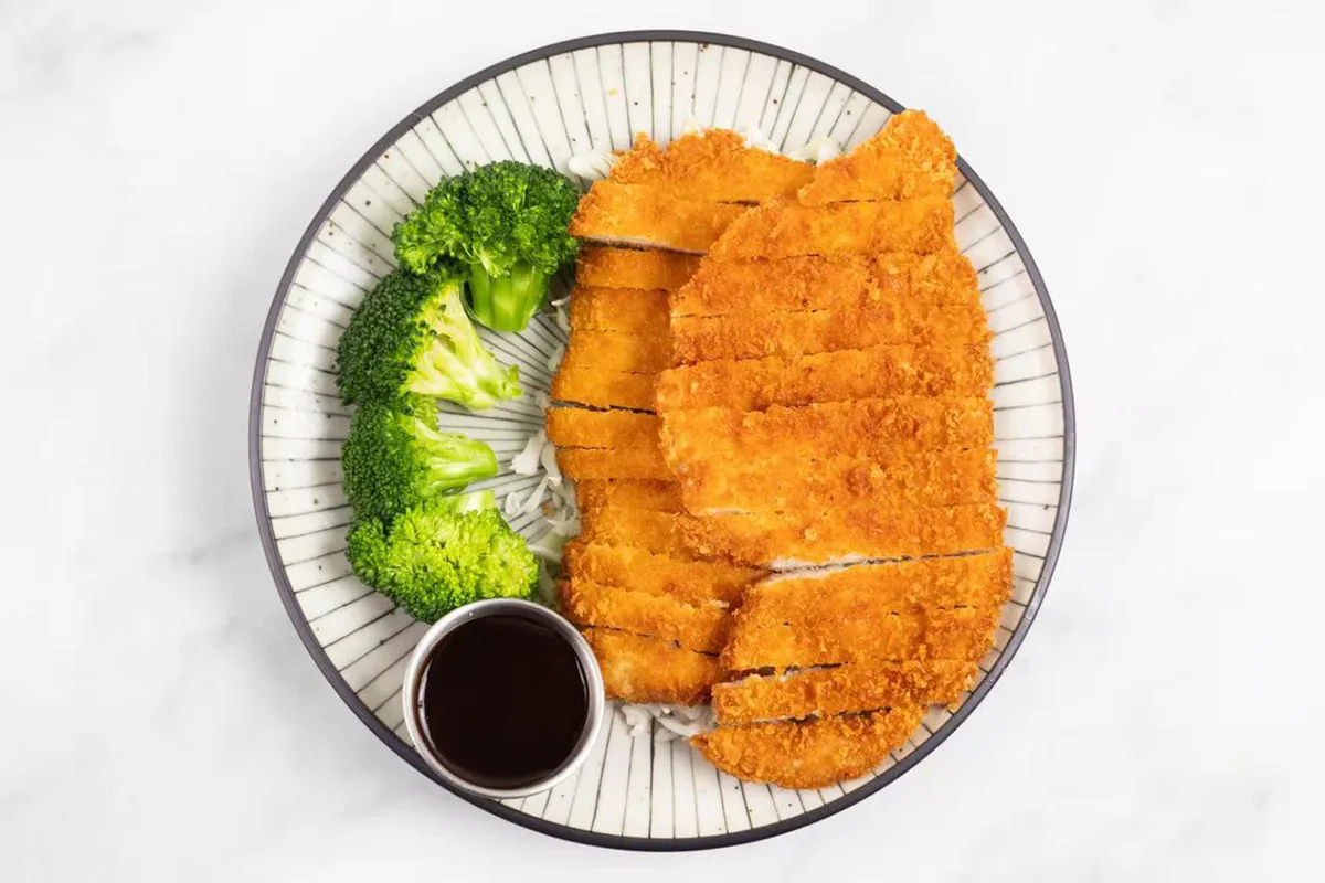Crispy chicken katsu with broccoli and sauce at Wabi Wok & Ramen, an Asian Restaurant in Milford