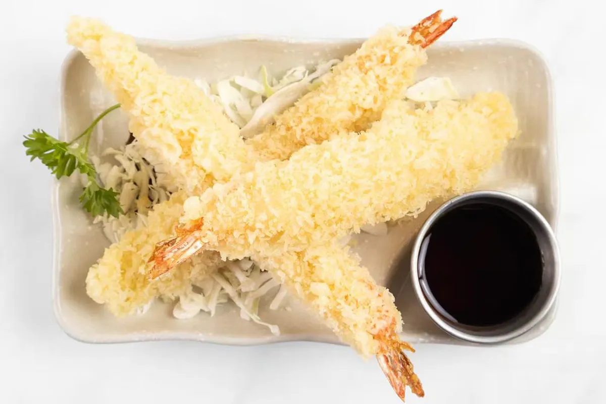 Shrimp tempura with cabbage and dipping sauce at Wabi Wok & Ramen, an Asian Restaurant in Milford