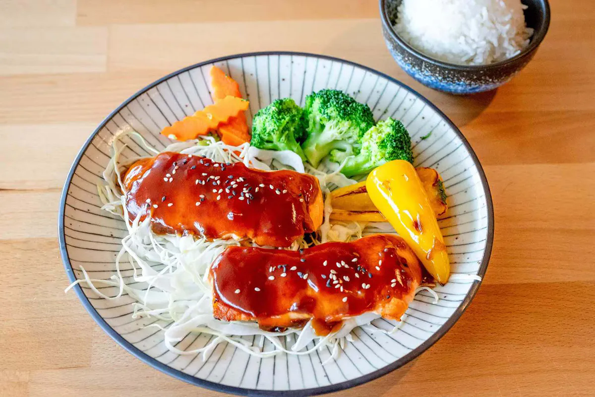 Teriyaki salmon with vegetables and white rice at Wabi Wok & Ramen, an Asian Restaurant in Milford